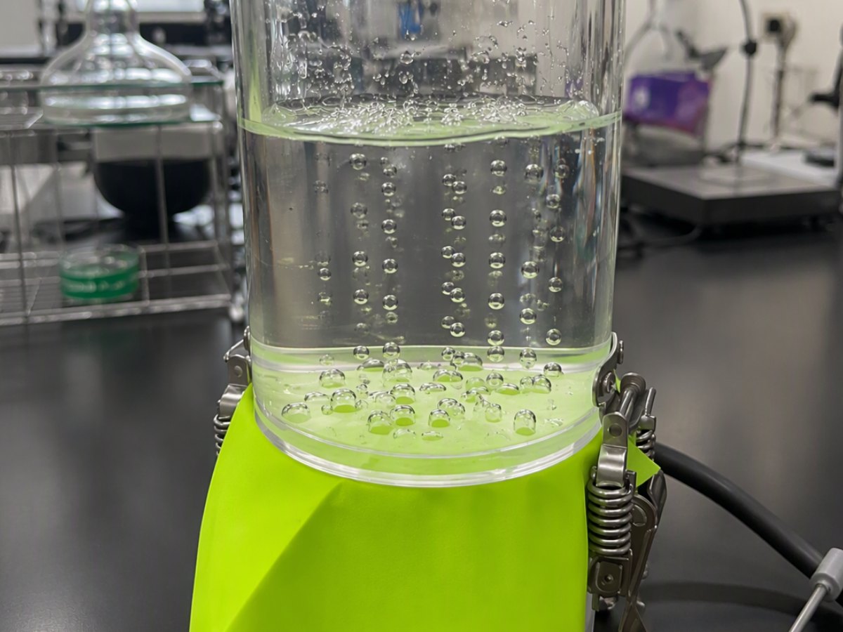 Air bubbles passing through ePTFE laminated fabric in a water test, showing true air permeability of the microporous membrane