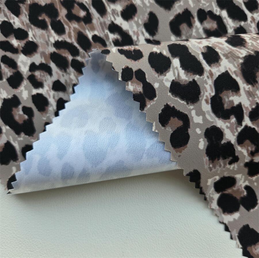 Fabric swatch — 320D Printed Taslan laminated with mid-permeability TPU 0.018 mm, face texture close-up
