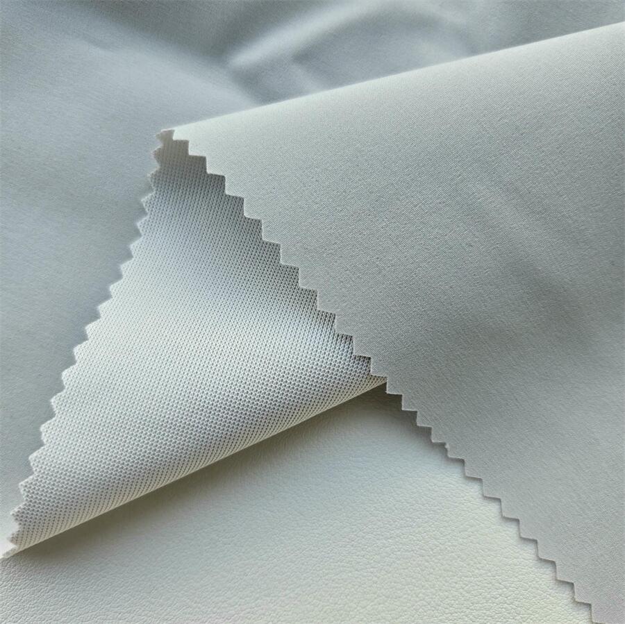 Fabric swatch — 70D Nylon 4-Way Stretch laminated with low-permeability TPU 0.008 mm + 30D white tricot, face texture close-up